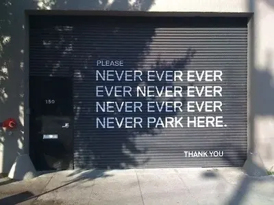 funny-pictures-never-ever-park-here-sign.webp